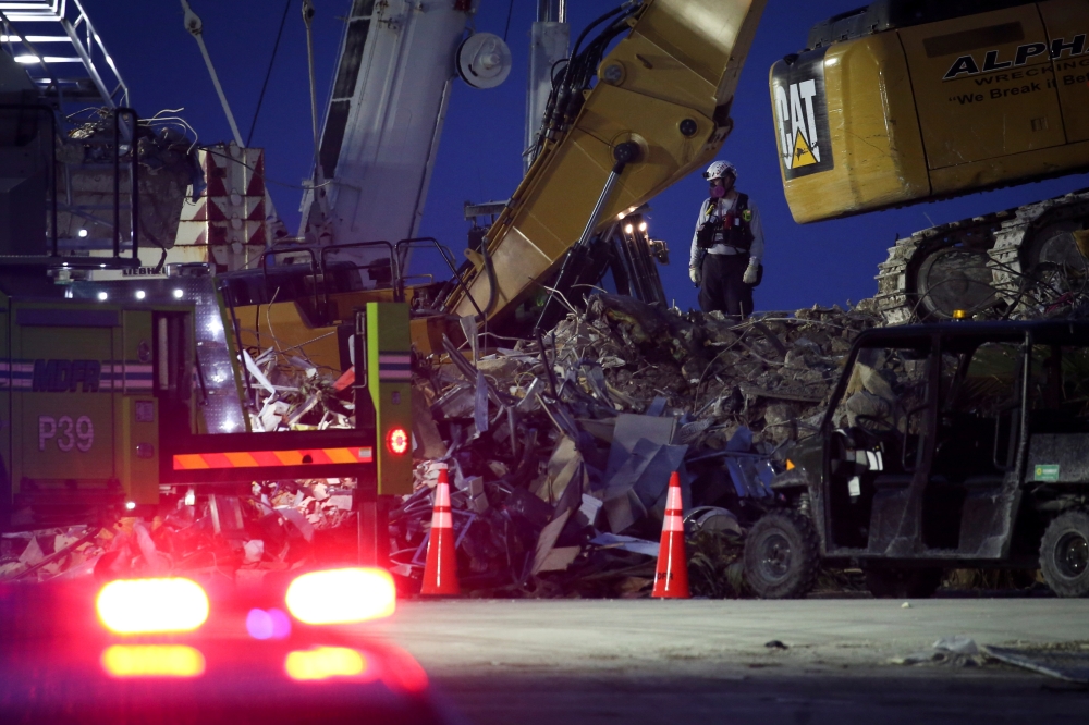 Search-and-rescue efforts continue after the managed demolition of the remaining part of Champlain Towers South complex in Surfside, Florida, U.S. July 6, 2021. REUTERS/Marco Bello