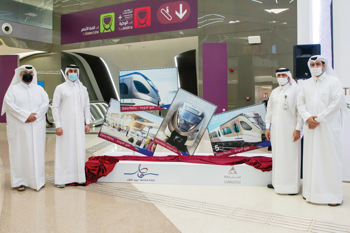 Officials at the launch of commemorative postage stamps for the Doha Metro. 