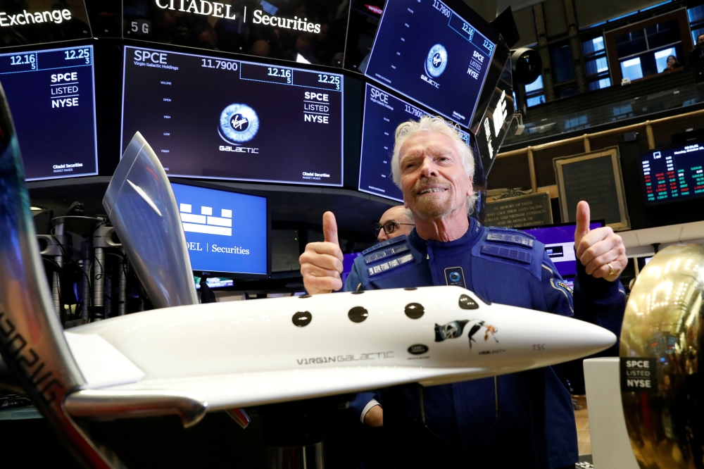 Sir Richard Branson poses on the floor of the New York Stock Exchange (NYSE) ahead of Virgin Galactic (SPCE) trading in New York, U.S., October 28, 2019. REUTERS/Brendan McDermid/File Photo
