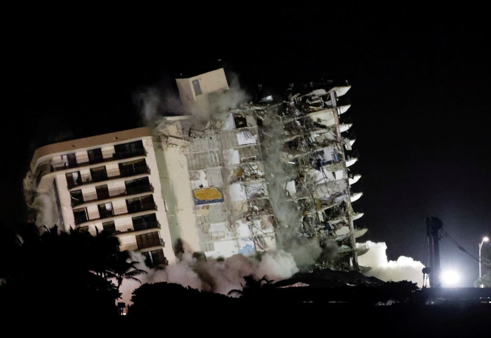 The partially collapsed Champlain Towers South residential building is demolished, in Surfside, Florida, July 4, 2021. REUTERS/Marco Bello/File Photo