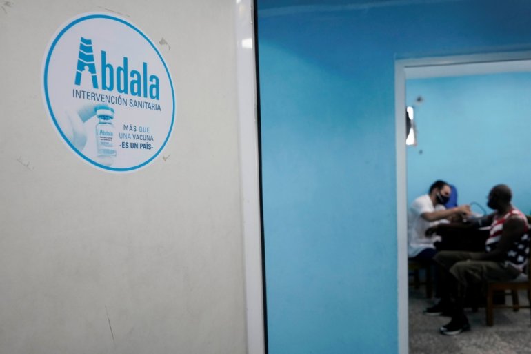 A man has his blood pressure taken before being vaccinated at a vaccination center amid concerns about the spread of the coronavirus disease (COVID-19), in Havana, Cuba, June 17, 2021. REUTERS/Alexandre Meneghini