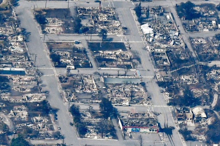 The charred remnants of homes and buildings, destroyed by a wildfire on June 30, are left behind in Lytton, British Columbia, Canada July 6, 2021, as seen in this aerial photograph. REUTERS/Jennifer Gauthier/File Photo

