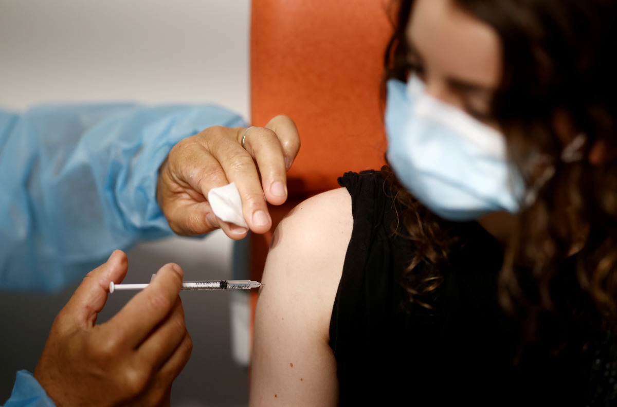 FILE PHOTO: A medical worker administers a dose of the 