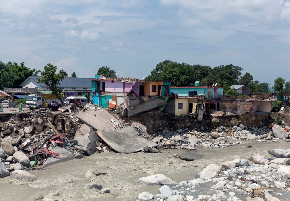 A view shows damaged houses along Manjhi River after flash floods in Chetru village in the Kangra district of the northern state of Himachal Pradesh, India, July 13, 2021. REUTERS/Stringer
