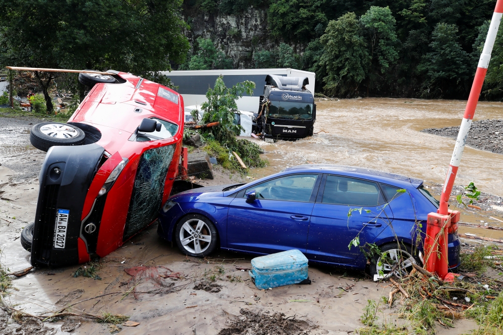 Cars destroyed by flood are pictured on a flood-affected area, following heavy rainfalls in Schuld, Germany, July 15, 2021. (REUTERS/Wolfgang Rattay)