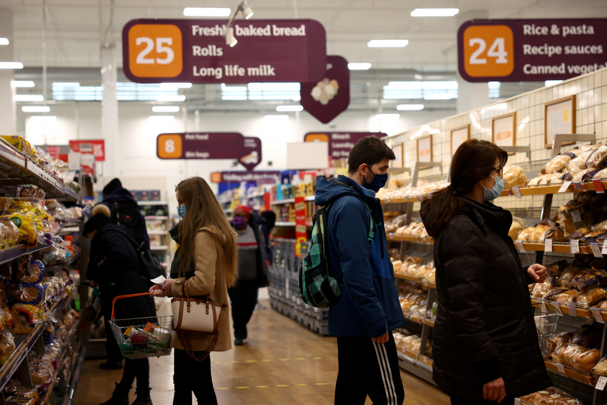 FILE PHOTO: Shoppers look at bread in a Sainsbury's supermarket, amid the coronavirus disease (COVID-19) outbreak, in London, Britain January 12, 2021. REUTERS/Henry Nicholls/File Photo
