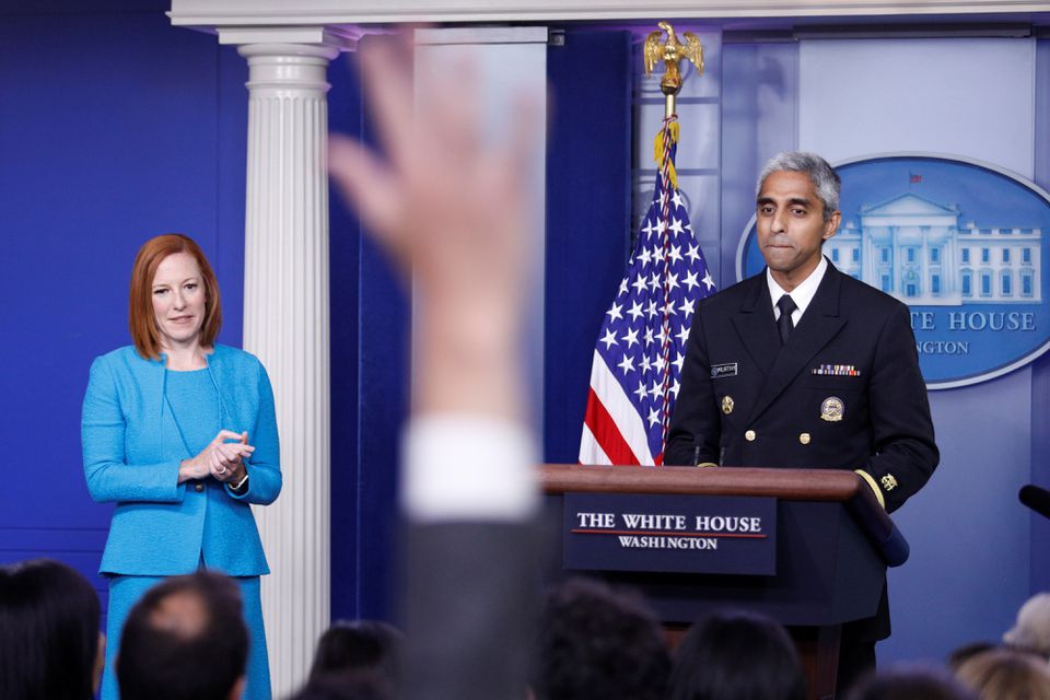 A journalist raises a hand to ask a question during United States Surgeon General Vivek Murthy’s remarks at a news conference with White House Press Secretary Jen Psaki at the White House in Washington, U.S., July  15, 2021. REUTERS/Tom Brenner
