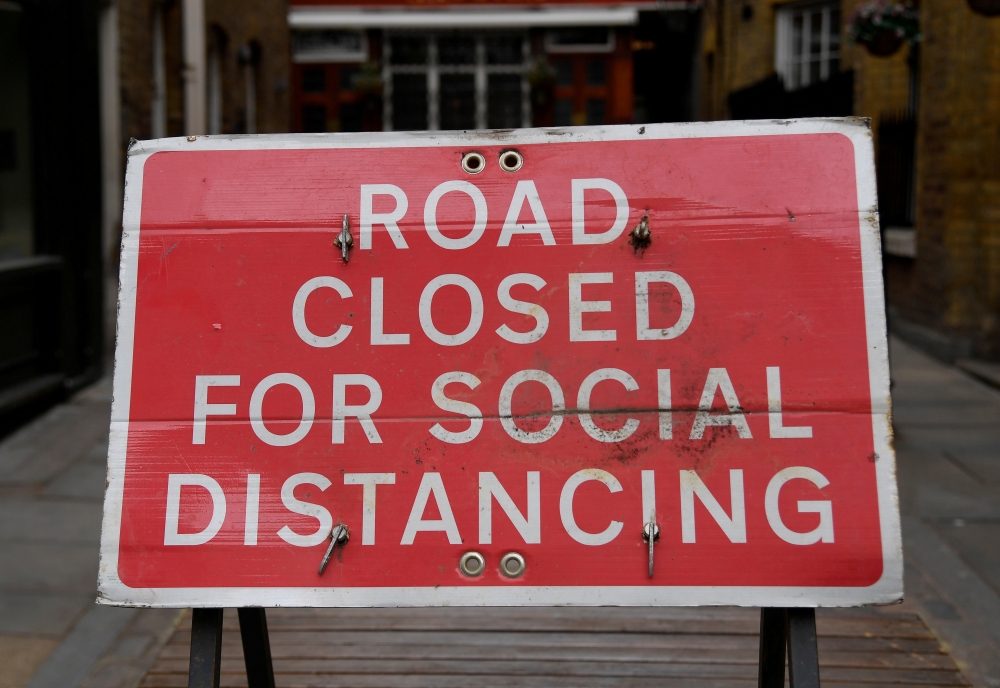 A sign is seen on a road in Covent Garden ahead of a further easing of lockdown restrictions for England on April 12, amid the spread of the coronavirus disease (COVID-19) pandemic, in London, Britain, April 6, 2021. REUTERS/Toby Melville/File Photo
