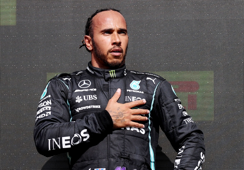 July 18, 2021 Mercedes' Lewis Hamilton celebrates on the podium after winning the race Pool via REUTERS/Lars Baron