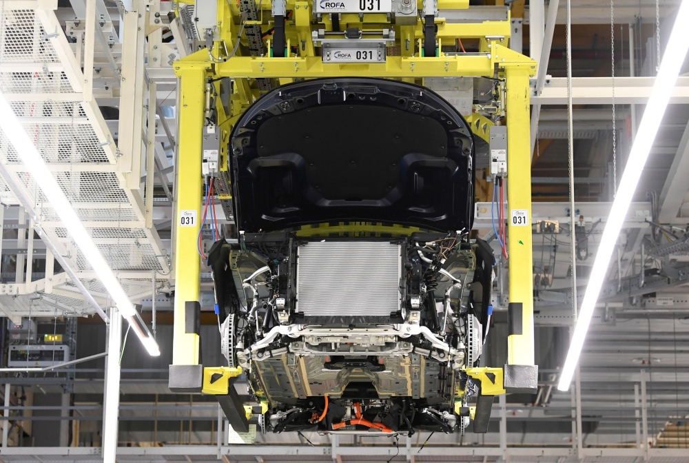 A battery cell is installed at a Mercedes-Benz EQC electric car in a production line at a plant in Bremen, Germany, January 29, 2020. REUTERS/Fabian Bimmer/File Photo