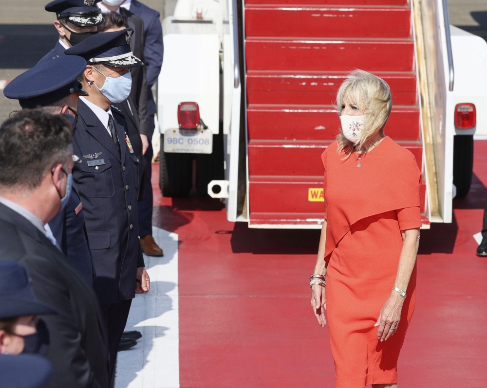 U.S. First Lady Jill Biden is greeted by Japanese and U.S delegates upon her arrival at Yokota Air Base for attending the opening ceremony of the Tokyo 2020 Olympic Games in Tokyo July 22, 2021, Japan, in this photo released by Kyodo. Mandatory credit Kyo