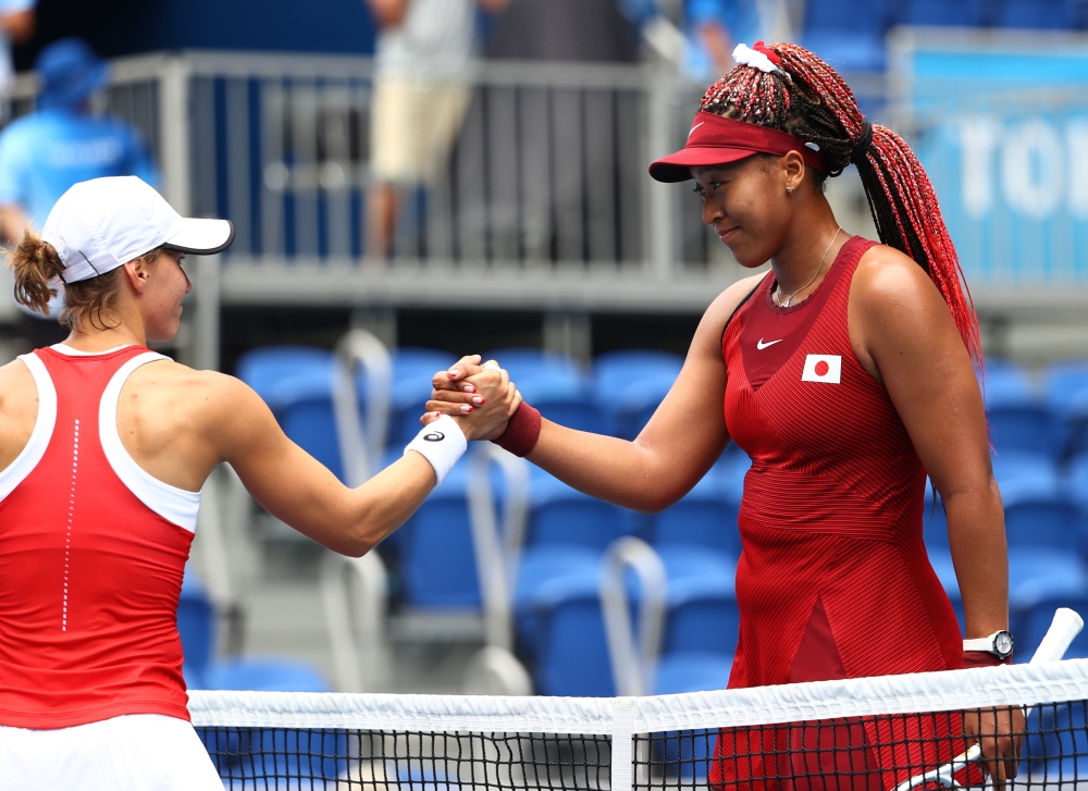 Naomi Osaka of Japan shakes hands with Viktorija Golubic of Switzerland after winning her second-round match Reuters/Mike Segar
