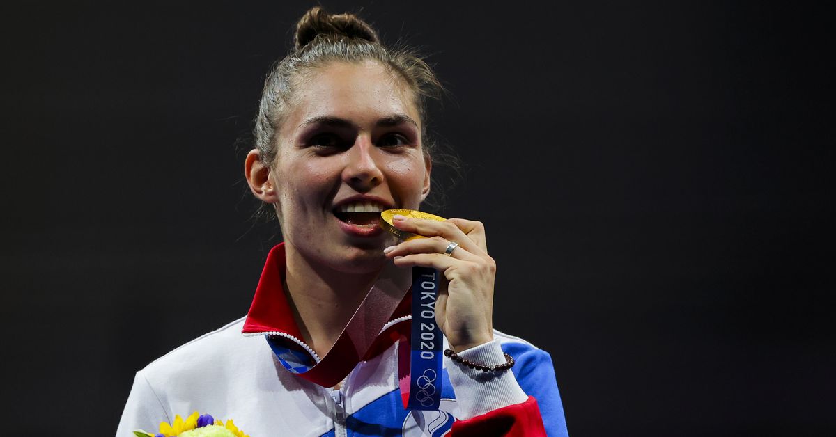 Tokyo 2020 Olympics - Fencing - Women's Individual Sabre - Medal Ceremony - Makuhari Messe Hall B, Chiba, Japan - July 26, 2021. Gold medallist Sofia Pozdniakova of the Russian Olympic Committee celebrates on the podium REUTERS/Maxim Shemetov
