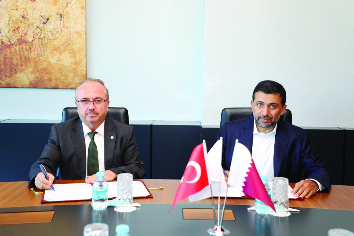 President of Qatar University H E Dr. Hassan bin Rashid Al Derham and President of Turkish Maarif Foundation Prof. Birol Akgun signing a cooperation protocol.