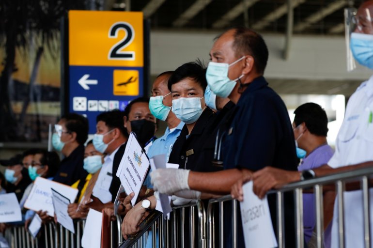 Hotel drivers wait for passengers at the airport, as Phuket reopens to overseas tourists, allowing foreigners fully vaccinated against the coronavirus disease (COVID-19) to visit the resort island without quarantine, in Phuket, Thailand July 1, 2021. REUT