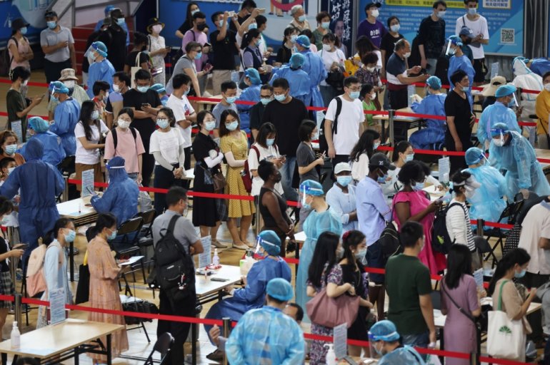 People line up for nucleic acid testing at a sports centre in Gulou district, during a citywide mass testing following new cases of the coronavirus disease (COVID-19) in Nanjing, Jiangsu province, China July 22, 2021. cnsphoto via REUTERS