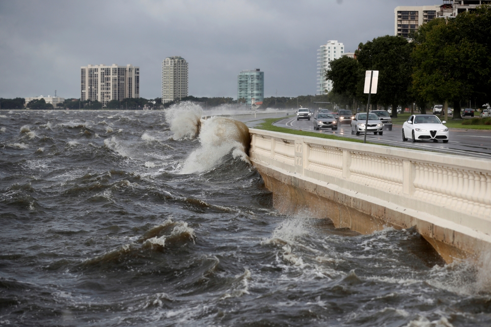 Waves crash the balustrades on Bayshore Boulevard during high tide after Tropical Storm Elsa churns up the Gulf coast, in Tampa, Florida, U.S., July 7, 2021. REUTERS/Octavio Jones/File Photo
