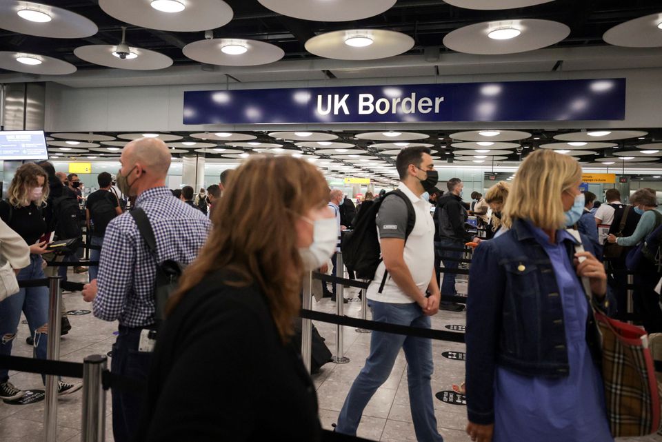 Arriving passengers queue at UK Border Control at the Terminal 5 at Heathrow Airport in London, Britain June 29, 2021. REUTERS/Hannah Mckay

