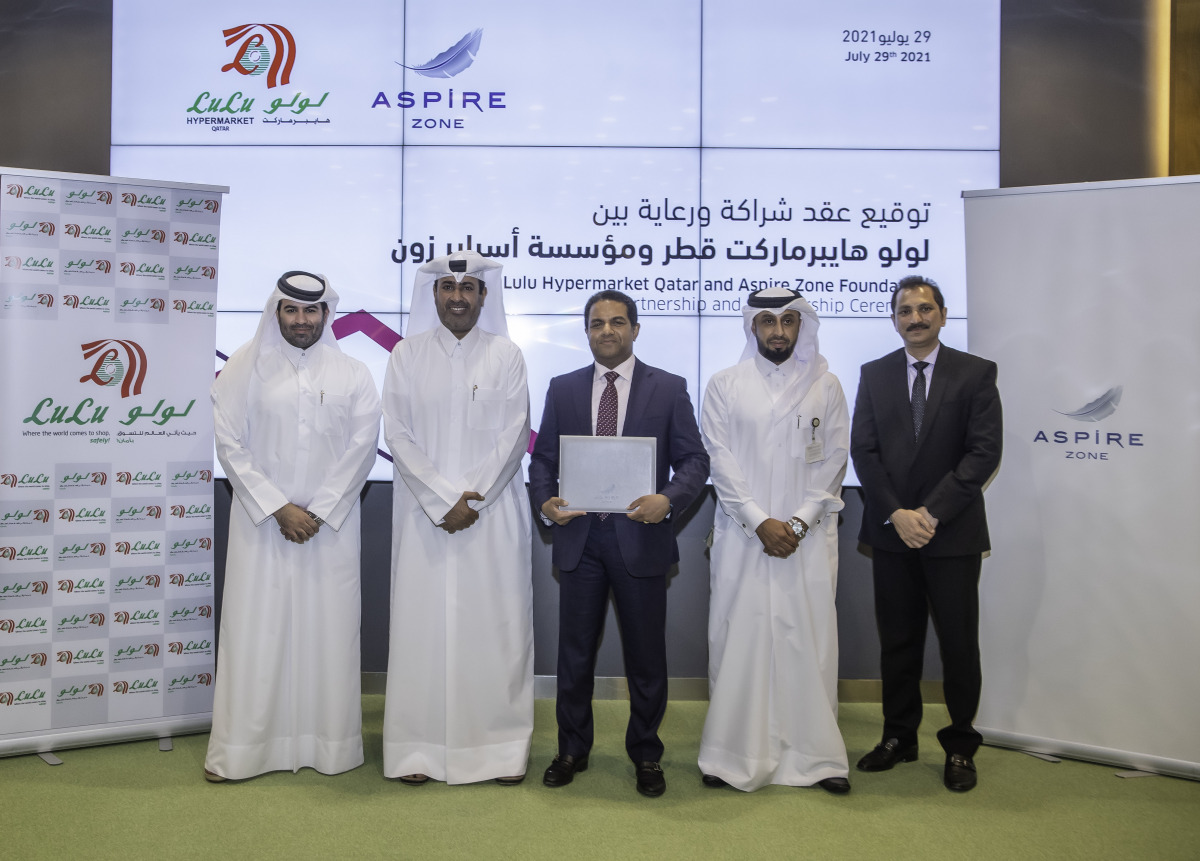 Director General of Aspire Logistics, Abdullah Nasser Al Naemi and Director of Lulu Group International, Dr. Mohamed Althaf with other officials during an agreement signing ceremony. 