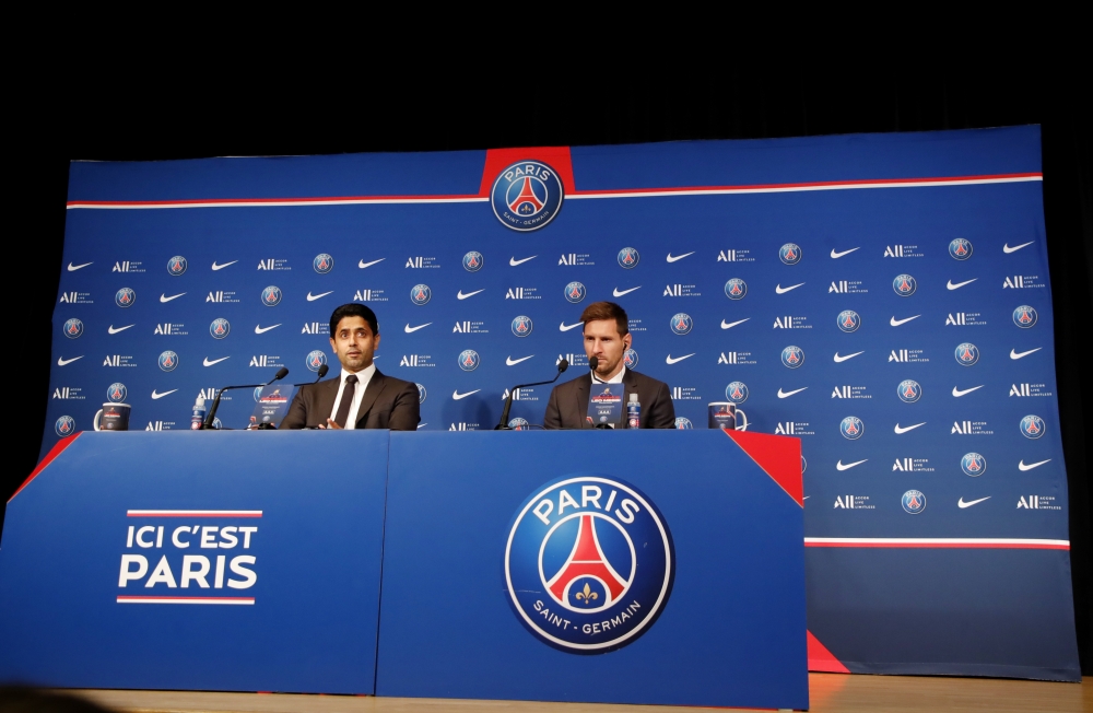 Paris St Germain's Lionel Messi and president Nasser Al-Khelaifi during the press conference REUTERS/Sarah Meyssonnier