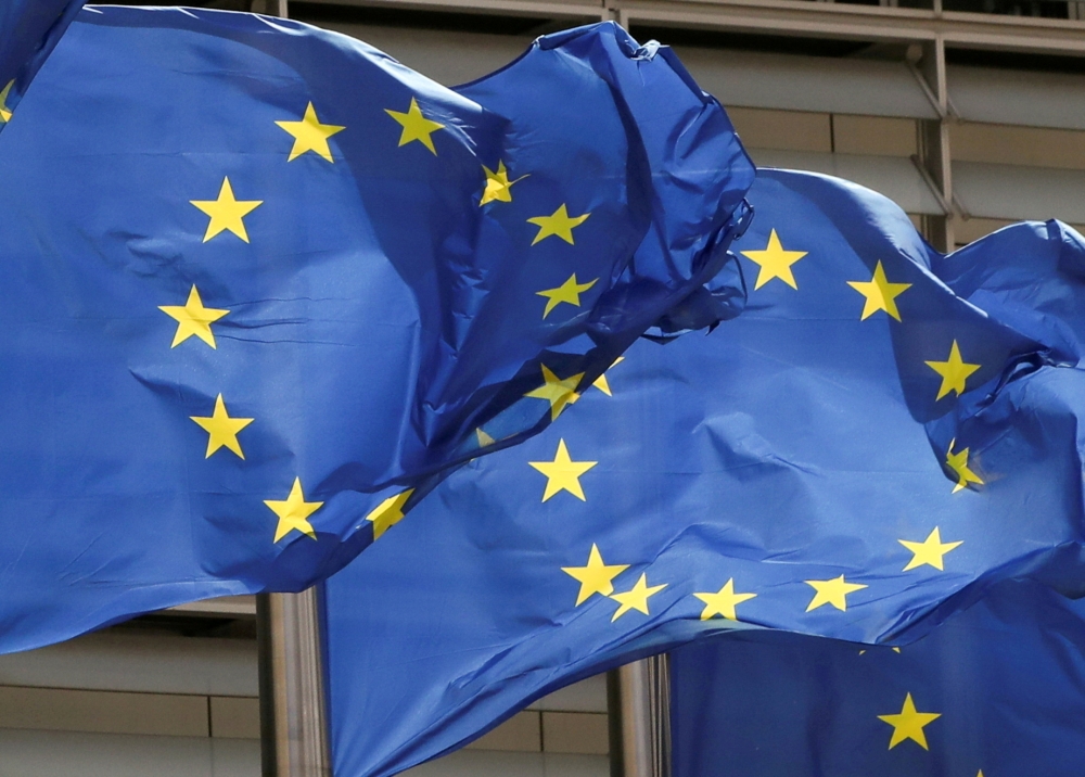 European Union flags flutter outside the EU Commission headquarters in Brussels, Belgium May 5, 2021. REUTERS/Yves Herman/File Photo
