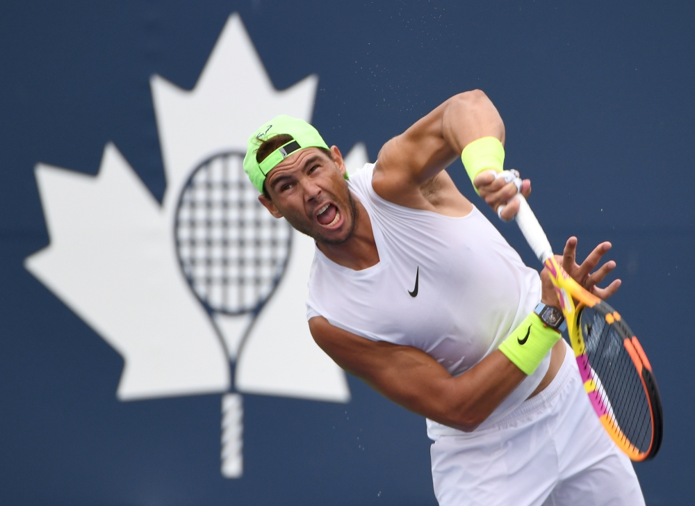 Rafael Nadal of Spain hits a serve as he practices on a day off before playing in the National Bank Open at Aviva Centre. Mandatory Credit: Dan Hamilton-USA TODAY Sports