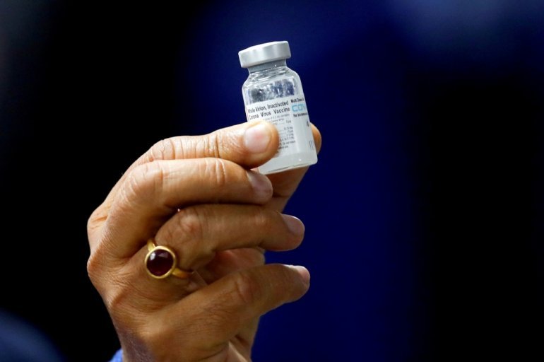 FILE PHOTO: Indian Health Minister Harsh Vardhan holds a dose of Bharat Biotech's COVID-19 vaccine called COVAXIN, during a vaccination campaign at All India Institute of Medical Sciences (AIIMS) hospital in New Delhi, India, January 16, 2021. Reuters/Adn