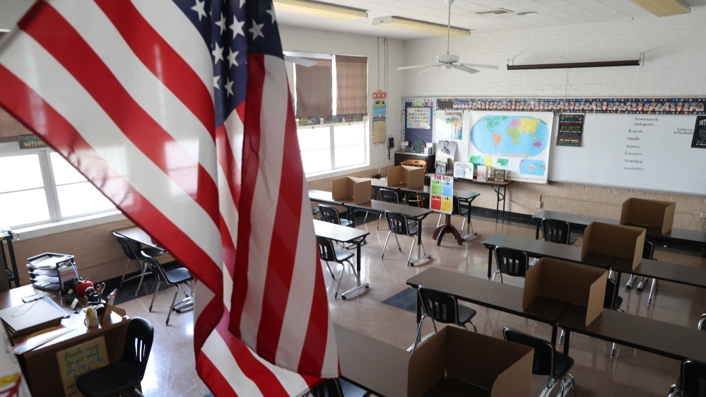 FILE PHOTO: Social distancing dividers for students are seen in a classroom at St. Benedict School, amid the outbreak of the coronavirus, in Montebello, near Los Angeles, California, July 14, 2020. REUTERS/Lucy Nicholson/File Photo