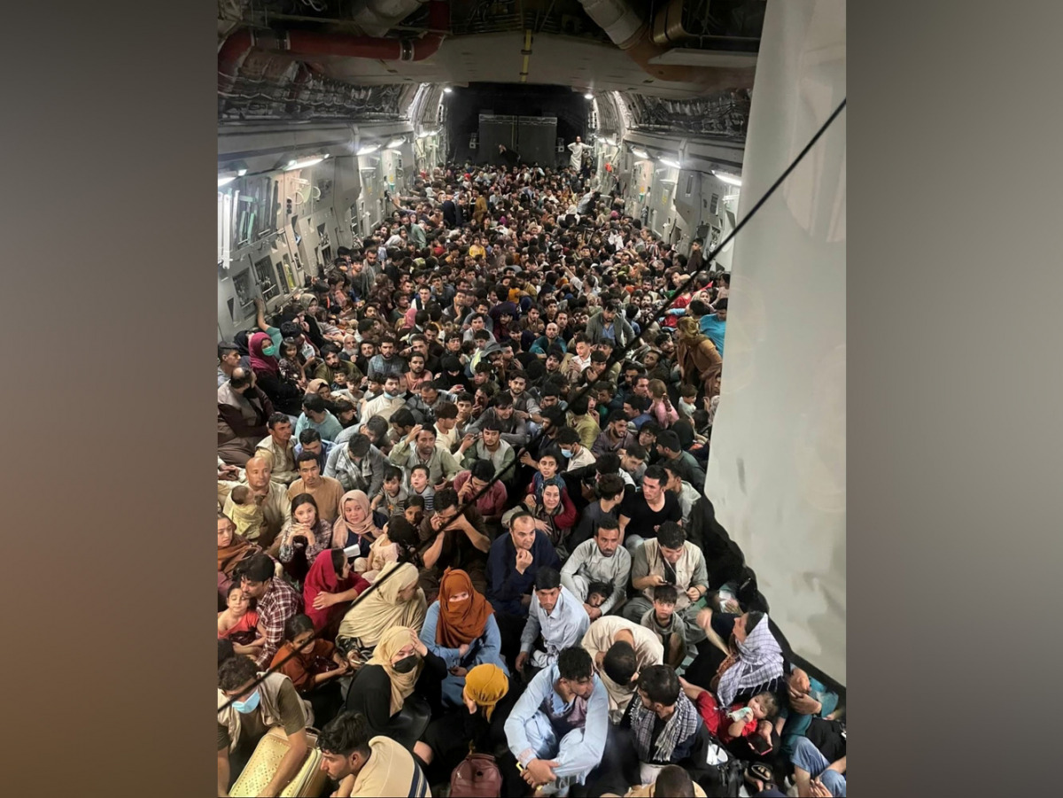 Evacuees crowd the interior of a U.S. Air Force C-17 Globemaster III transport aircraft. Picture taken August 15, 2021. Courtesy of Defense One/Handout via Reuters
