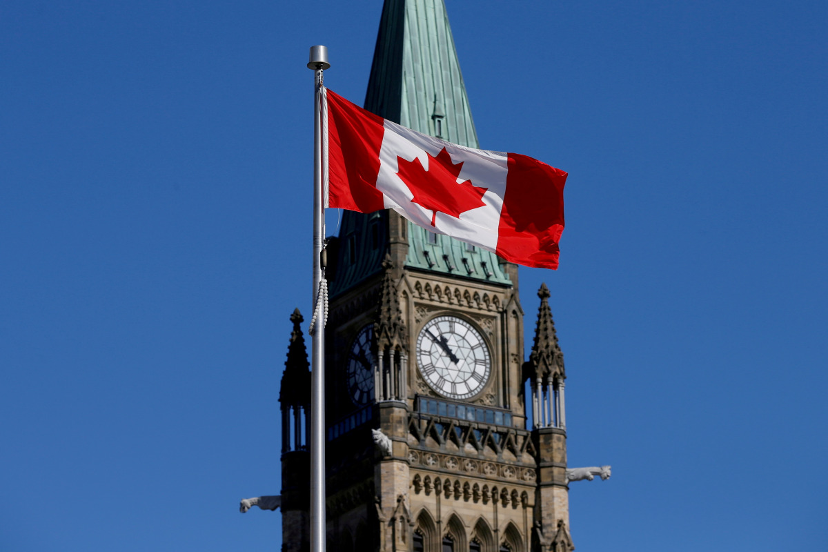 FILE PHOTO: A Canadian flag flies in front of the Peace Tower on Parliament Hill in Ottawa, Ontario, Canada, March 22, 2017. REUTERS/Chris Wattie/File Photo/File Photo
