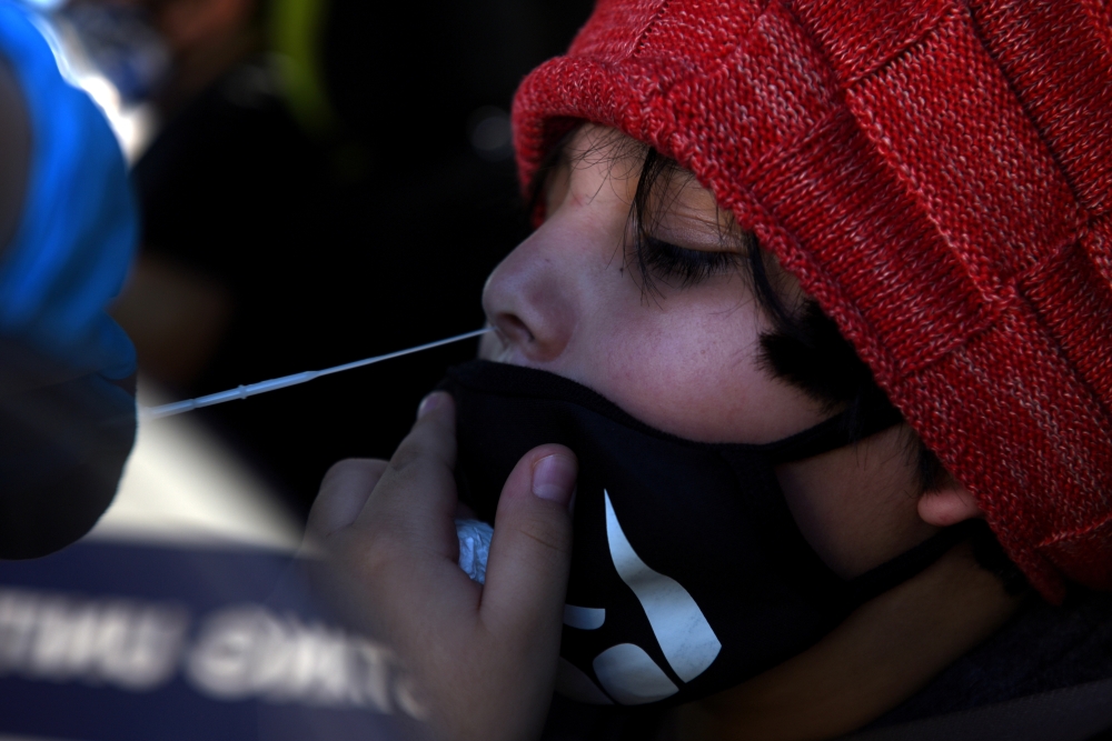 A young boy is tested for the coronavirus disease (COVID-19) at a mobile testing site as the country sees an increase in children infected with COVID-19, in Houston, Texas, U.S., August 16, 2021. Reuters/Callaghan O'Hare/File Photo