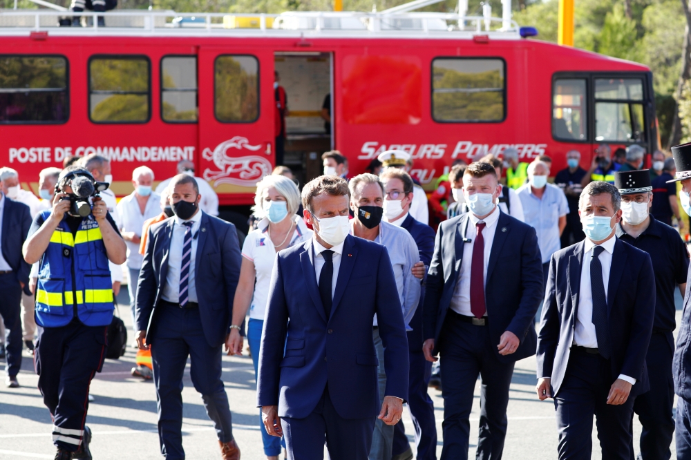 French President Emmanuel Macron and Interior Minister Gerald Darmanin visit the SDIS (Departmental fire and rescue service) and firefighters headquarter in Le Luc, near Saint-Tropez, France August 17, 2021. Guillaume Horcajuelo/Pool via REUTERS