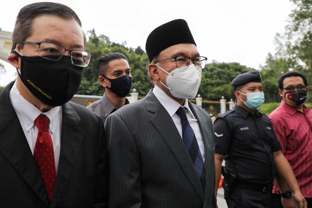 Malaysia opposition leaders Anwar Ibrahim and Lim Guan Eng leave National Palace after meeting with the King, in Kuala Lumpur, Malaysia August 17, 2021. Reuters/Lim Huey Teng