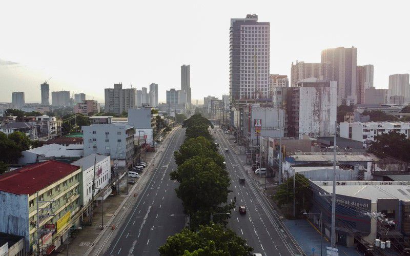 An aerial view shows minimal traffic in a main thoroughfare in Quezon City, during a two-week lockdown following a surge in coronavirus disease (COVID-19) cases, in Metro Manila, Philippines August 9, 2021. REUTERS/Adrian Portugal

