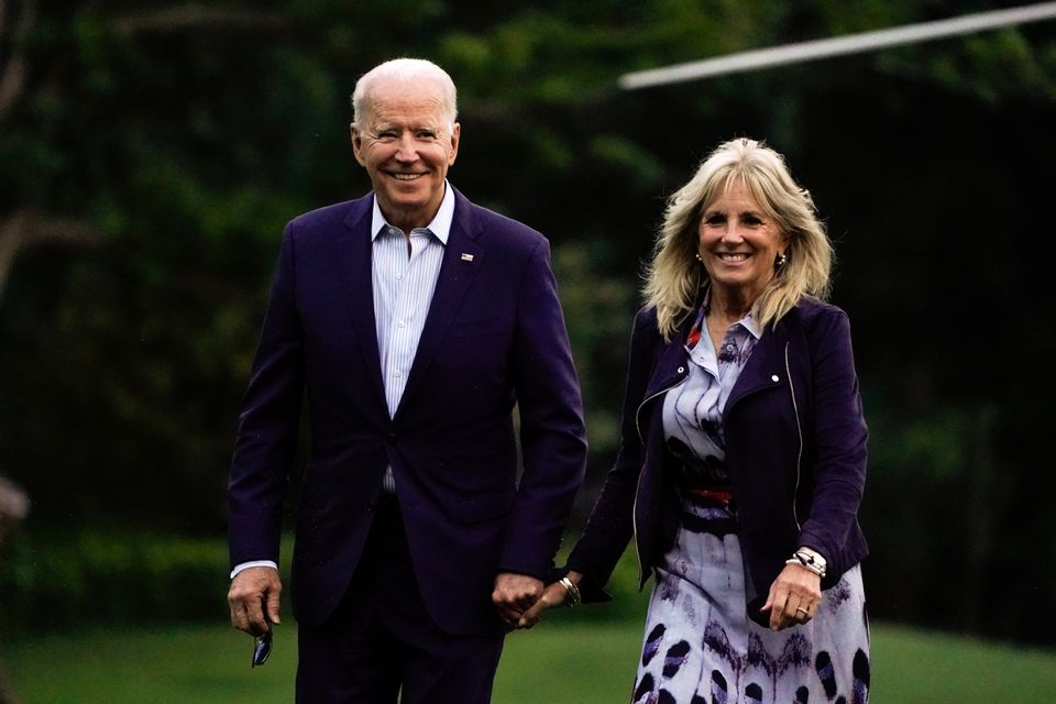 U.S. President Joe Biden and first lady Jill Biden walk from Marine One as they return from Camp David, on the South Lawn at the White House in Washington, U.S., July 18, 2021. REUTERS/Elizabeth Frantz

