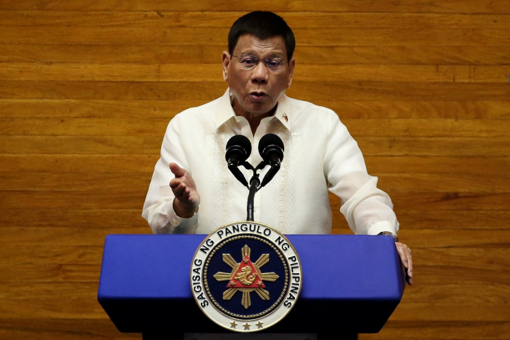 Philippine President Rodrigo Duterte gestures as he delivers his 6th State of the Nation Address (SONA), at the House of Representative in Quezon City, Metro Manila, Philippines, July 26, 2021. REUTERS/Lisa Marie David/File Photo