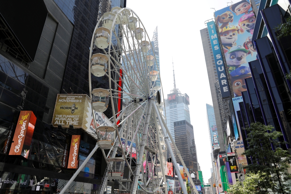 A view shows the Times Square Wheel, a Ferris wheel constructed in Times Square, ahead of its opening in Manhattan, New York City, U.S., August 25, 2021. REUTERS/Andrew Kelly