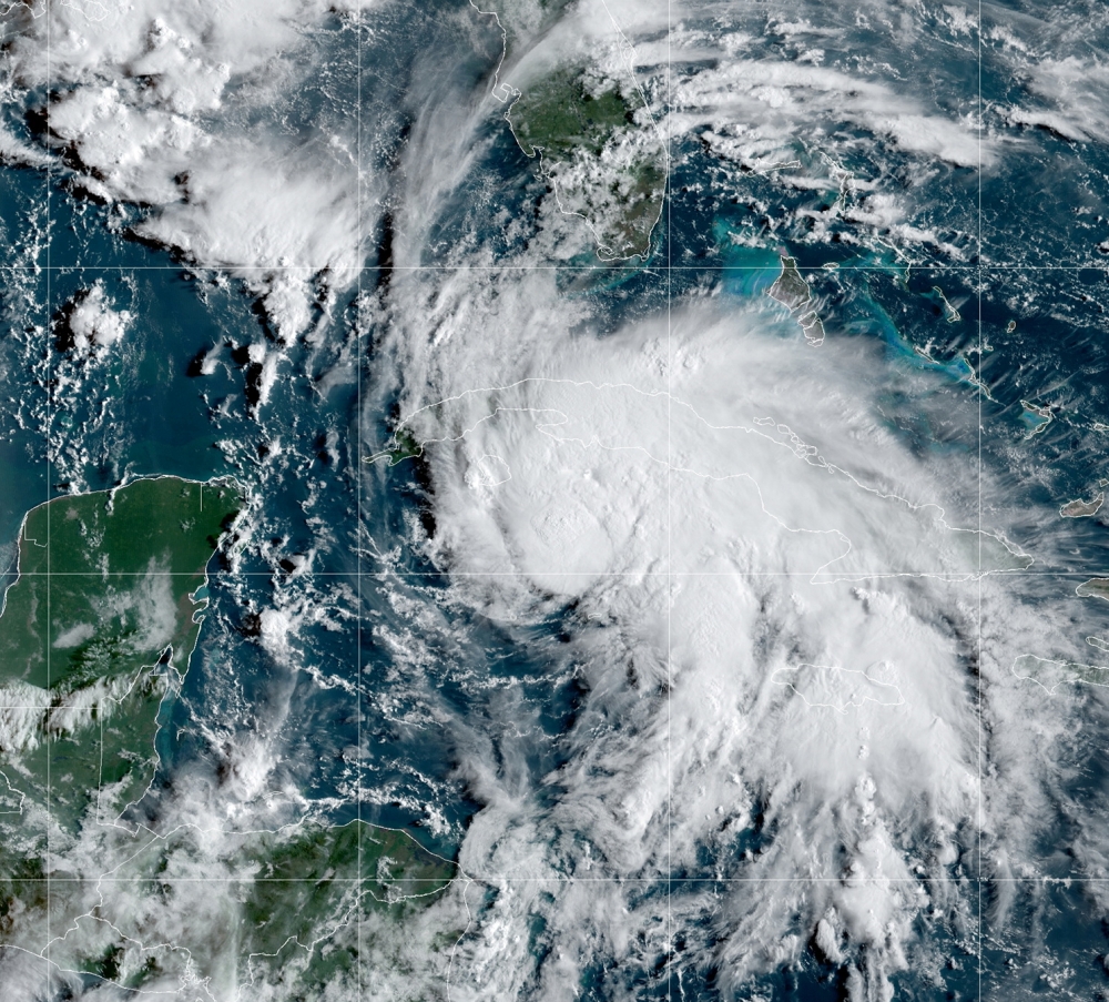 A satellite image shows Tropical Storm Ida after forming in the Caribbean, about 75 miles (125 kilometers) north-northwest of Grand Cayman, August 27, 2021. NOAA/Handout via REUTERS