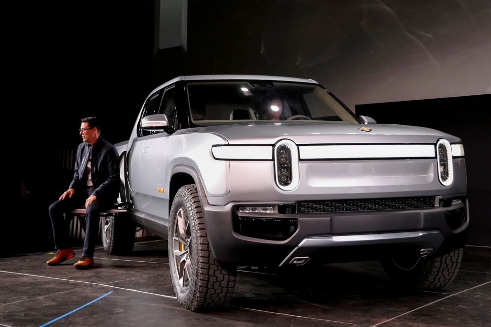 R.J. Scaringe, Rivian's CEO, introduces his company's R1T all-electric pickup truck at Los Angeles Auto Show in Los Angeles, California, U.S. November 27, 2018. REUTERS/Mike Blake/File Photo