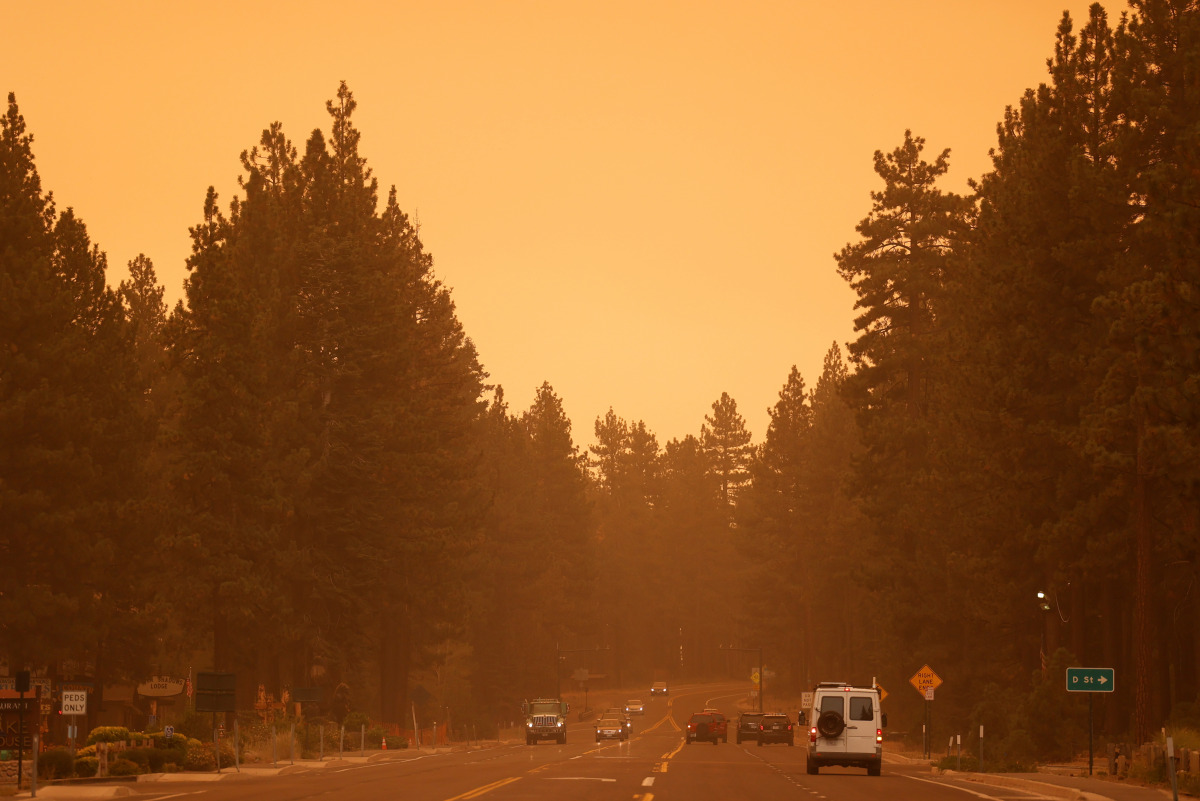 Heavy smoke from the Caldor Fire is seen along highway 50, in South Lake Tahoe, California, U.S., August 29, 2021. REUTERS/Fred Greaves
