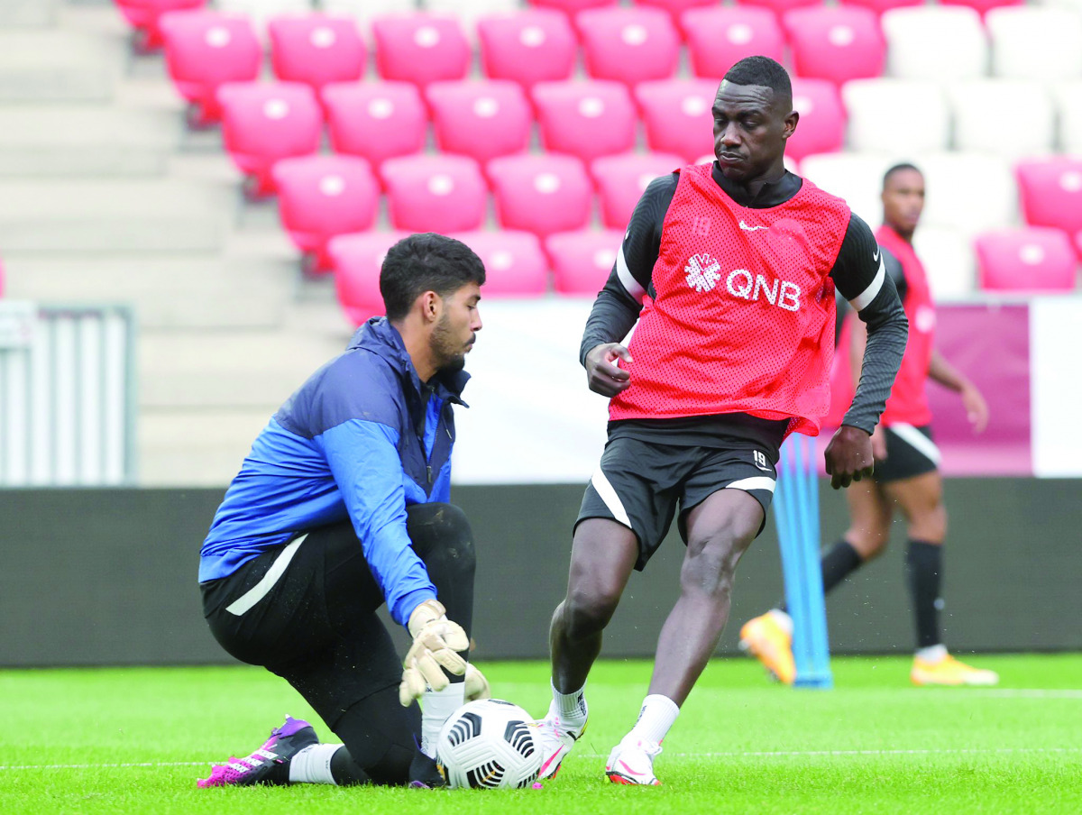 Qatar's Almoez Ali (right) with a team-mate during a pre-match training session at the Nagyerdei Stadion in Debrecen, yesterday.