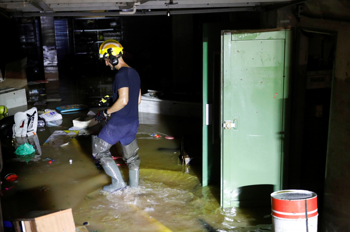A firefighter inspects a place affected by floods caused by heavy rains in ALCANAR, Spain, September 1, 2021. REUTERS/Eva Manez 