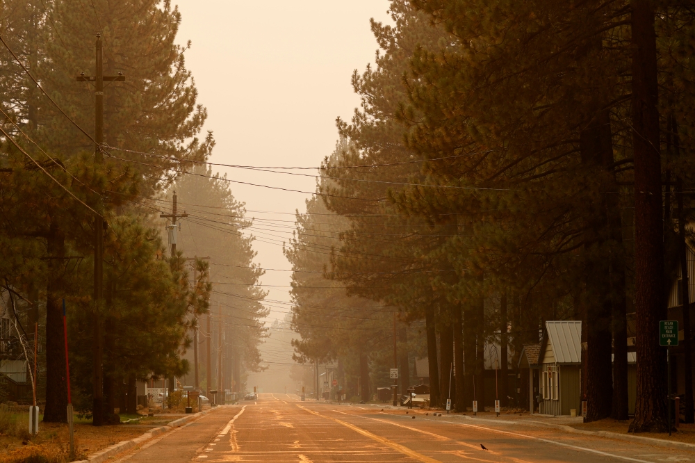 An empty street is seen after evacuations in South Lake Tahoe, California, U.S., September 1, 2021. REUTERS/Fred Greaves
