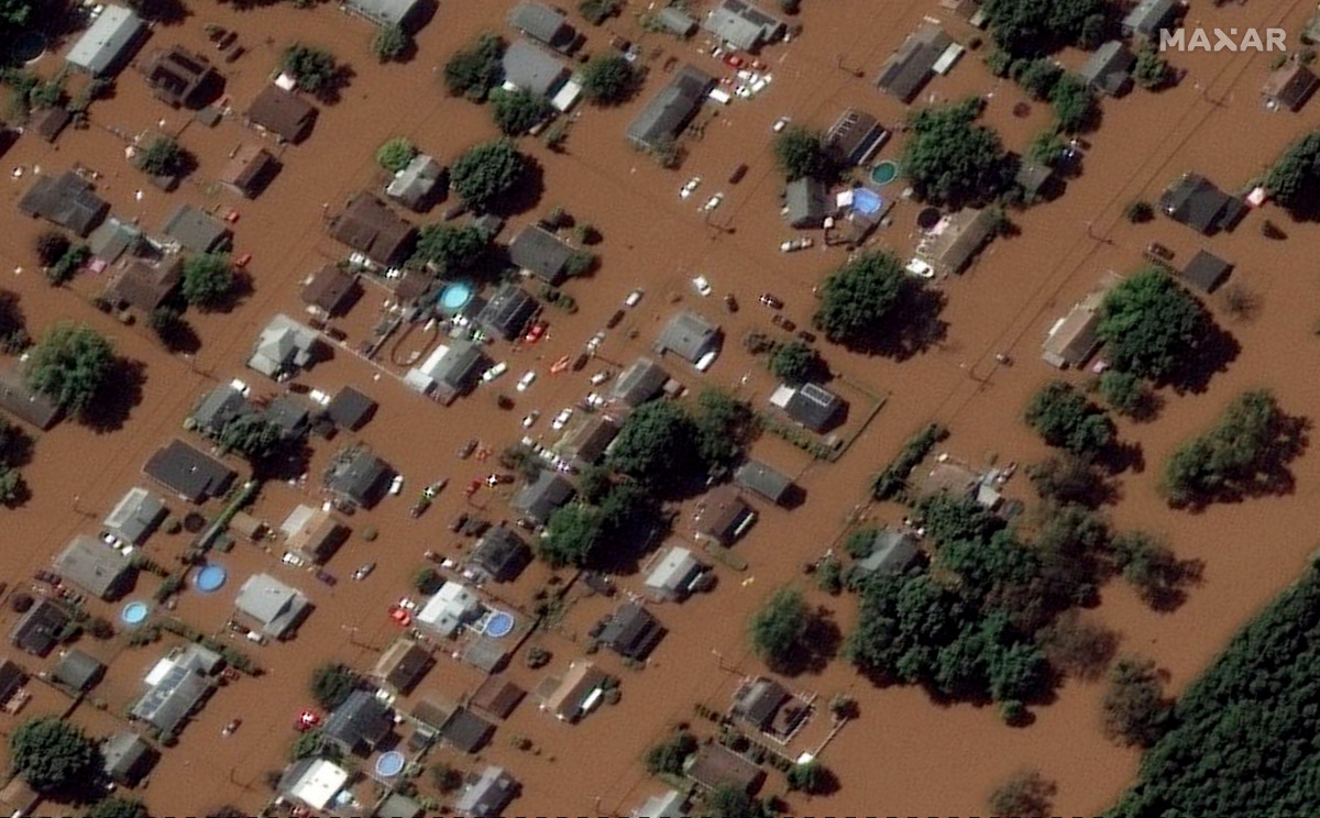 A satellite image shows houses submerged in floods caused by torrential rains unleashed by the remnants of Hurricane Ida, in Manville, New Jersey, U.S., September 2, 2021. Satellite image copyright 2021 Maxar Technologies/Handout via REUTERS