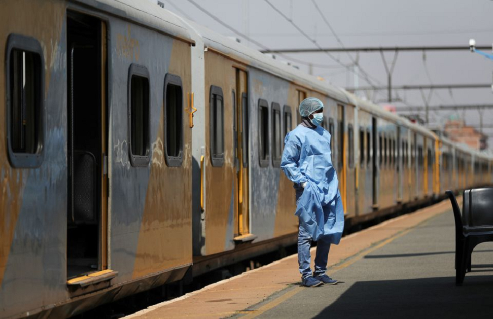 A health worker takes a break, as South Africa's rail company Transnet turned a train (not in the picture) into a coronavirus disease (COVID-19) vaccination center on rails to help the government speed up its vaccine rollout in the country's remote commun