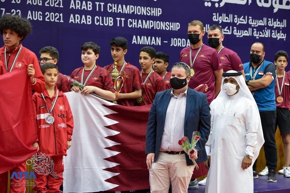 Khalil Ahmad Al Mohannadi, President of the Arab Table Tennis Federation, poses for a photograph with an official and the Qatar U-13 team members and coaches after presenting the medals to the winners in Amman, Jordan. Both Qatar U-13 and U-11 teams were 