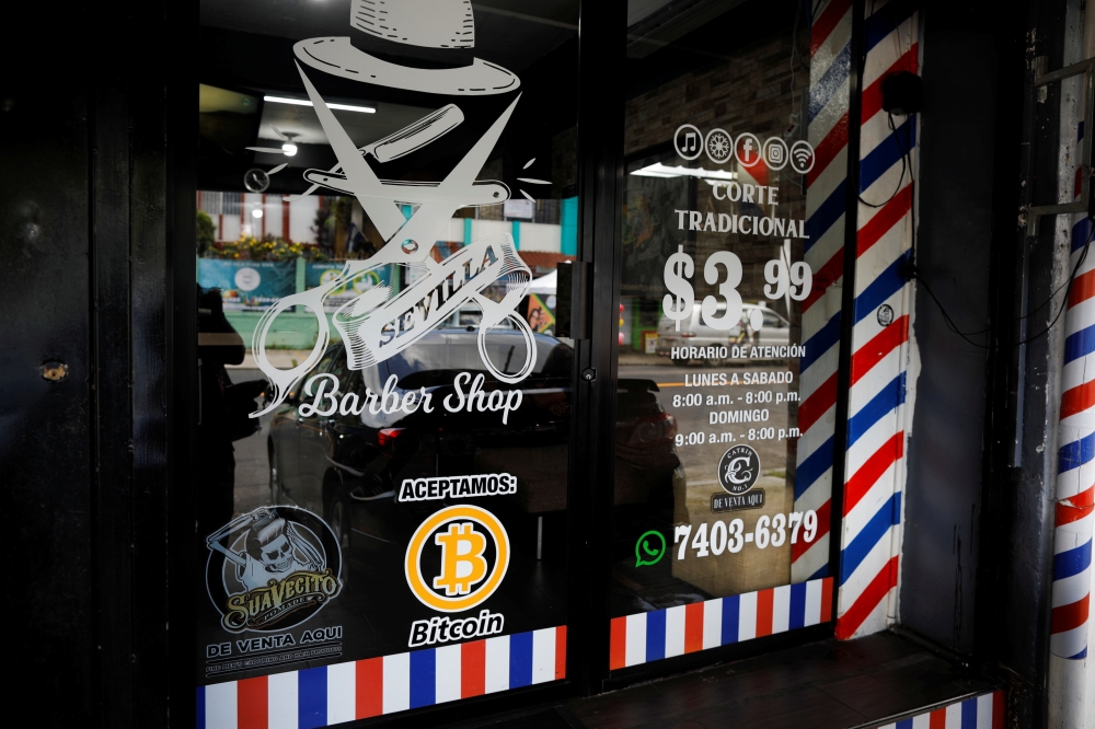 A Bitcoin logo is seen outside at Sevilla Barber Shop where Bitcoin is accepted as a payment method in Santa Tecla, El Salvador September 6, 2021. Reuters/Jose Cabezas
