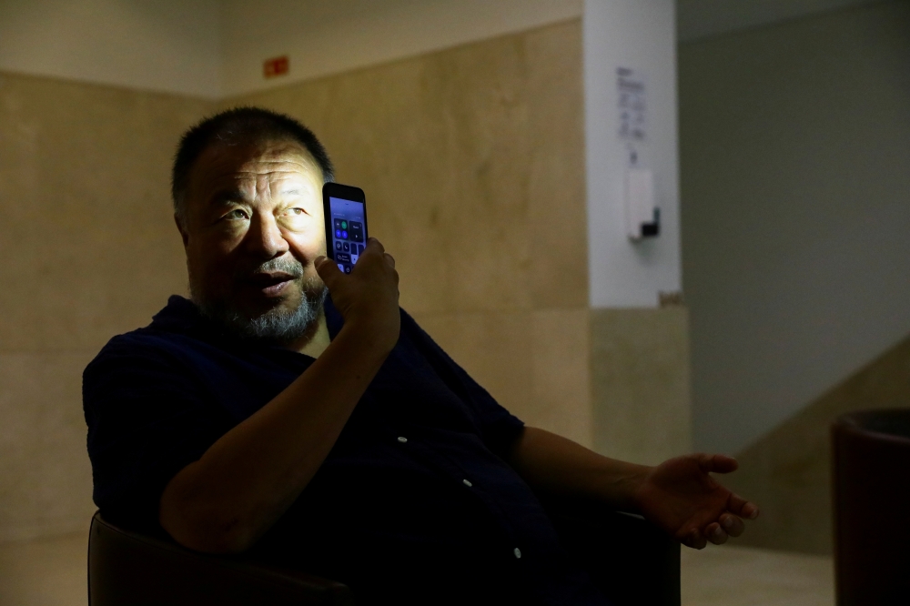 Chinese artist Ai Weiwei poses for a portrait during a presentation of his new exhibition 