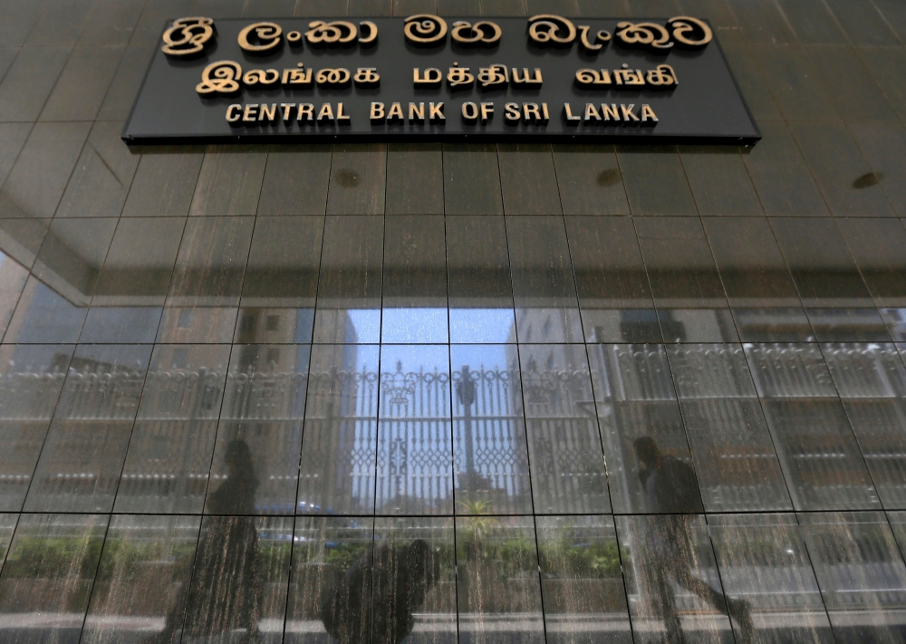 File photo: People walk past the main entrance of the Sri Lanka's Central Bank in Colombo, Sri Lanka March 24, 2017. Reuters/Dinuka Liyanawatte/File Photo