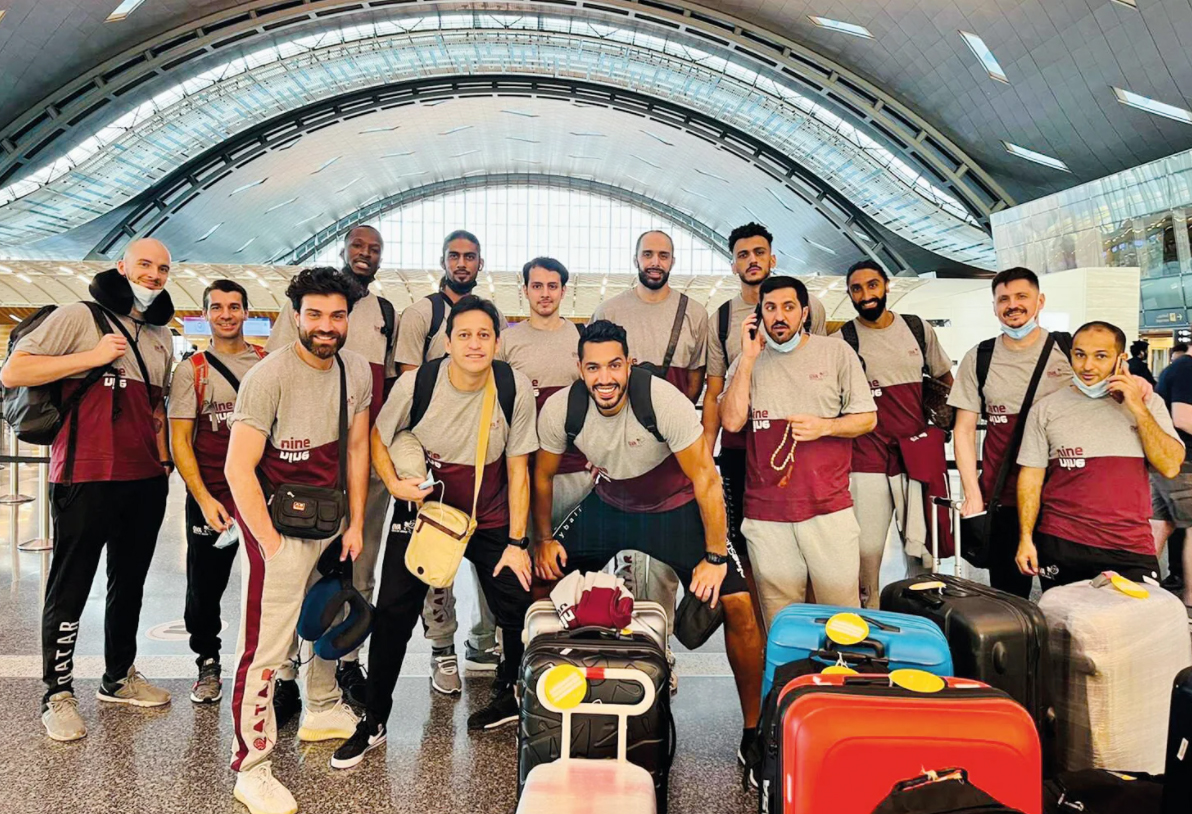 Qatar volleyball team's players and officials pose for a group picture prior to their departure for Japan in this file photo.